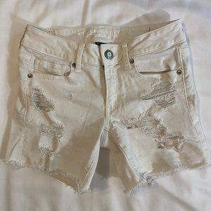 White Ripped Shorts Rolled and Unrolled